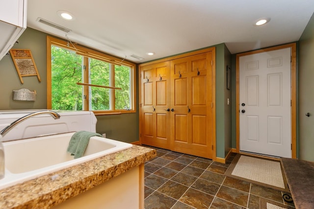 8935 180th St W, Faribault, MN 55021 - laundry room with recessed lighting, baseboards, cabinet space, washer and dryer, and dark stone finish flooring