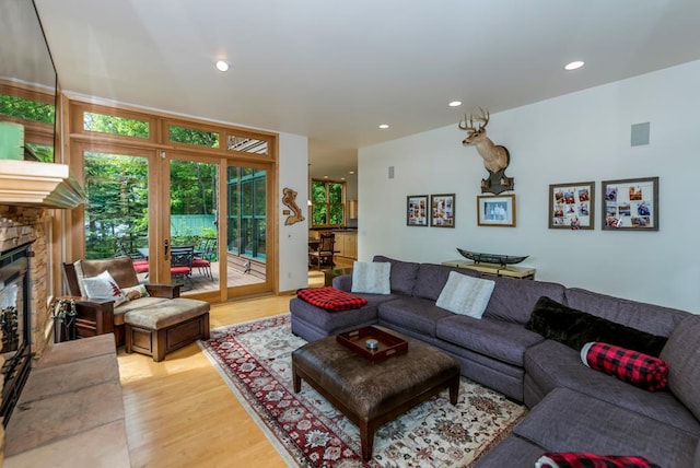 19260 Lakewood Dr, Deerwood Twp, MN 56444 - living area featuring light wood-style flooring, a fireplace, and recessed lighting