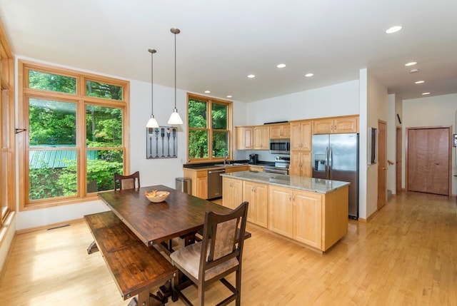 19260 Lakewood Dr, Deerwood Twp, MN 56444 - kitchen featuring appliances with stainless steel finishes, light brown cabinetry, light wood-type flooring, a center island, and recessed lighting