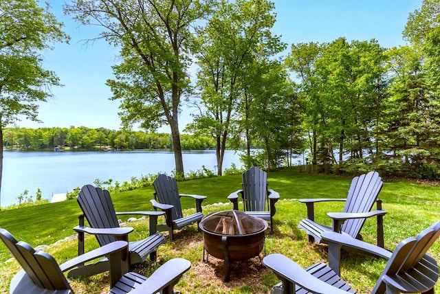 19260 Lakewood Dr, Deerwood Twp, MN 56444 - view of green lawn featuring an outdoor fire pit and a water view