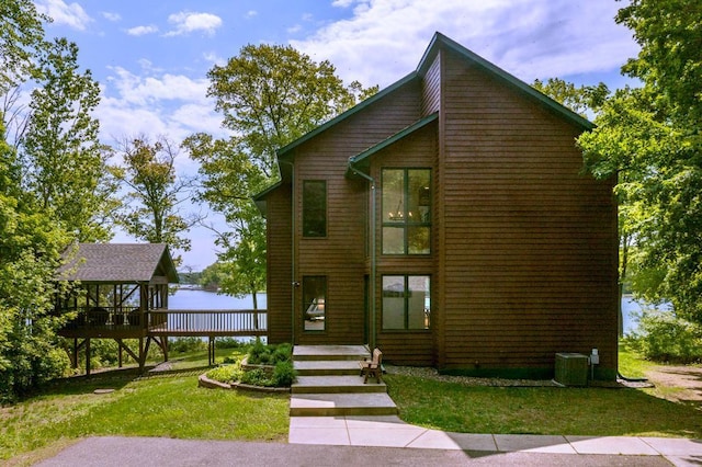 19260 Lakewood Dr, Deerwood Twp, MN 56444 - view of front of home featuring a deck, a front lawn, and central air condition unit