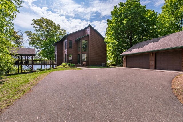 19260 Lakewood Dr, Deerwood Twp, MN 56444 - view of front of home featuring a water view and a detached garage