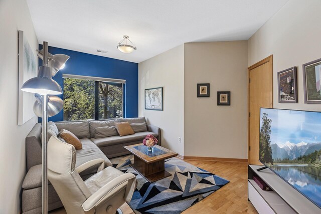198 Elm St, Saint Paul, MN 55102 - living room featuring baseboards and parquet floors