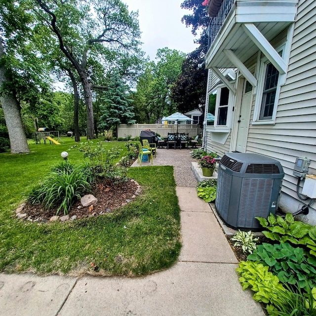 1308 73rd St, Richfield, MN 55423 - view of yard with a patio, central AC, and a playground