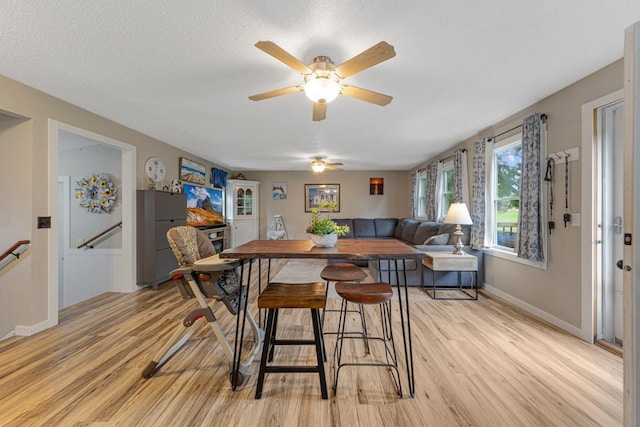 1858 Kennedy Ct, Northfield, MN 55057 - dining room featuring light wood-style floors, ceiling fan, and baseboards