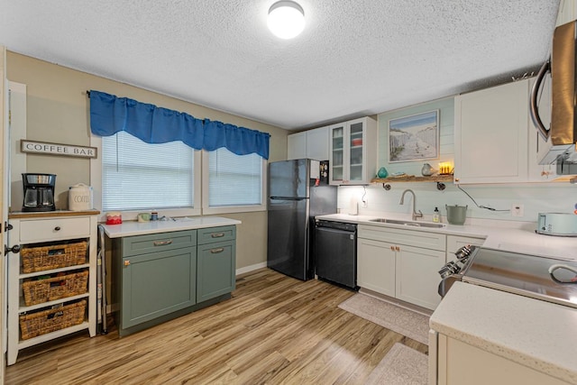 1858 Kennedy Ct, Northfield, MN 55057 - kitchen with a sink, dishwasher, freestanding refrigerator, green cabinetry, and light wood-style flooring