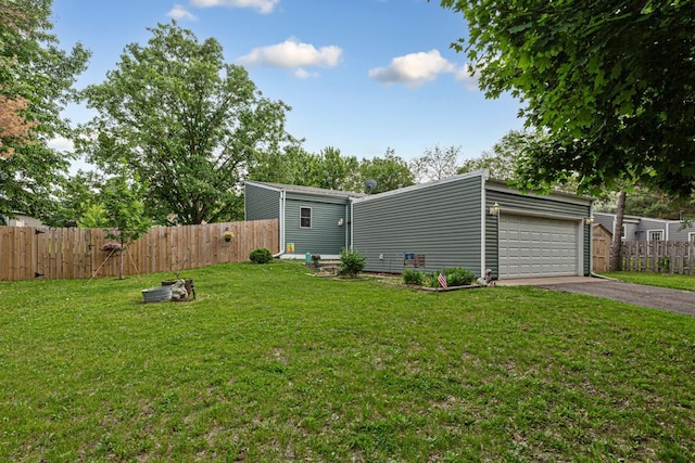 1858 Kennedy Ct, Northfield, MN 55057 - view of yard with a garage and asphalt driveway
