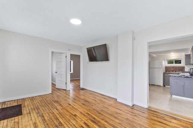 716 15th St NW, Bemidji, MN 56601 - empty room featuring light wood-style floors and baseboards