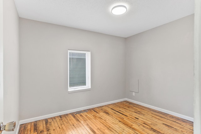 716 15th St NW, Bemidji, MN 56601 - unfurnished room featuring wood-type flooring and baseboards