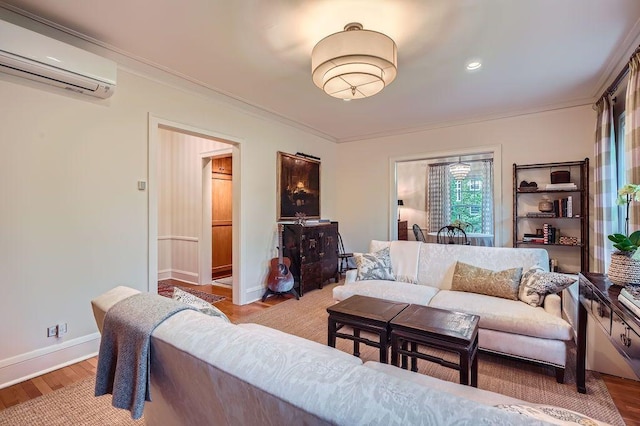 2517 Humboldt Ave S Unit 201, Minneapolis, MN 55405 - living room with a wall mounted AC, crown molding, wood finished floors, and baseboards