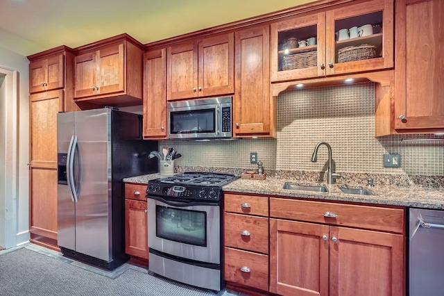 2517 Humboldt Ave S Unit 201, Minneapolis, MN 55405 - kitchen with stainless steel appliances, a sink, light stone counters, and backsplash