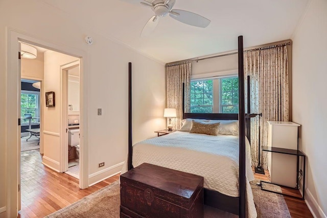 2517 Humboldt Ave S Unit 201, Minneapolis, MN 55405 - bedroom featuring wood finished floors, baseboards, crown molding, and ceiling fan