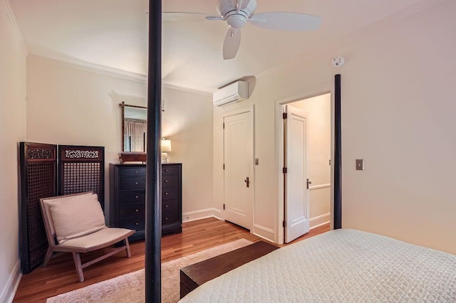2517 Humboldt Ave S Unit 201, Minneapolis, MN 55405 - bedroom with a wall mounted AC, wood finished floors, baseboards, ornamental molding, and a ceiling fan