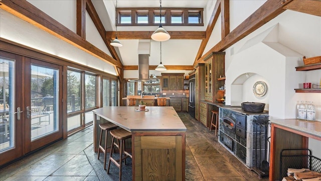 N30732 Square Bluff Rd, Blair, WI 54616 - kitchen featuring a center island, open shelves, high vaulted ceiling, high quality fridge, and beamed ceiling
