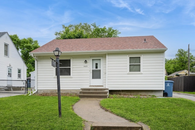 3425 Cleveland St NE, Minneapolis, MN 55418 - view of front facade featuring entry steps and a shingled roof