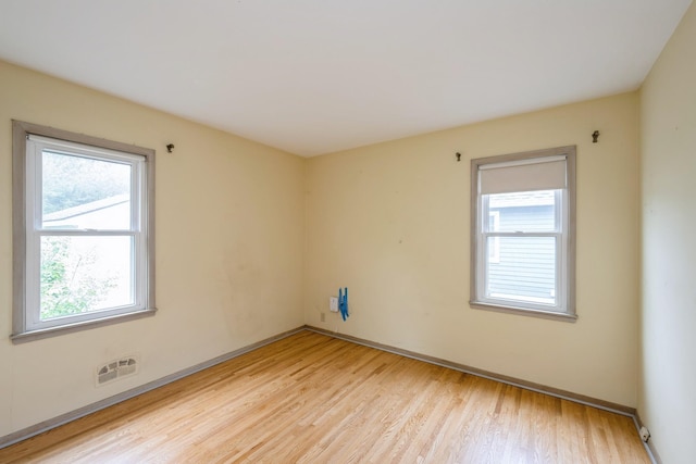 3425 Cleveland St NE, Minneapolis, MN 55418 - spare room featuring light wood-type flooring and baseboards