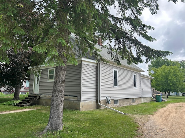 130 Tyler St, Tyler, MN 56178 - view of side of home with a yard
