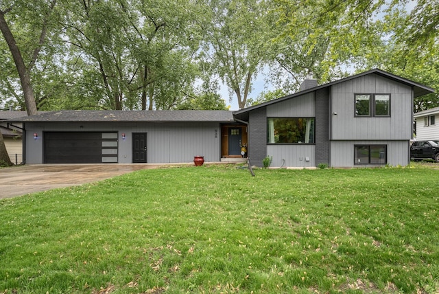 538 Silver Lake Rd NW, New Brighton, MN 55112 - view of front facade with a chimney, an attached garage, concrete driveway, a front lawn, and brick siding