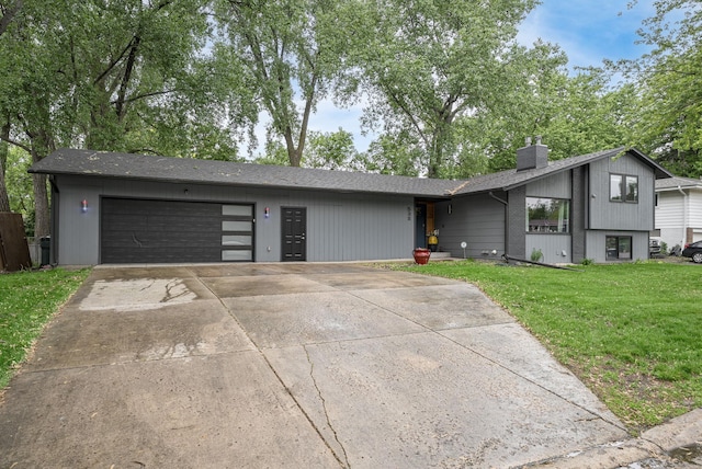 538 Silver Lake Rd NW, New Brighton, MN 55112 - view of front of property with a garage, a chimney, a front yard, concrete driveway, and a shingled roof