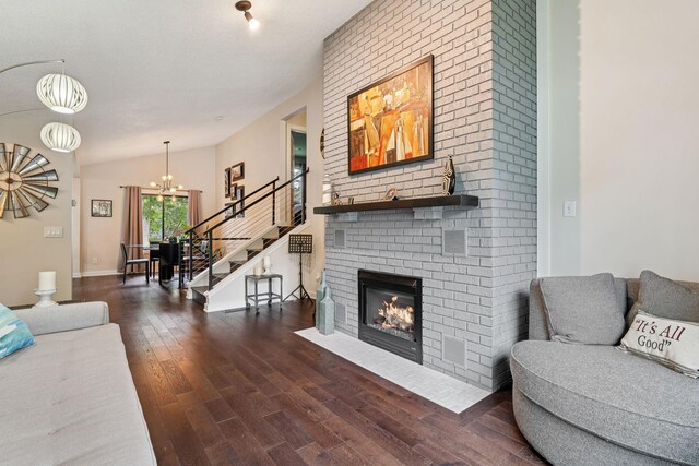 538 Silver Lake Rd NW, New Brighton, MN 55112 - living area with wood finished floors, stairs, a chandelier, and a fireplace