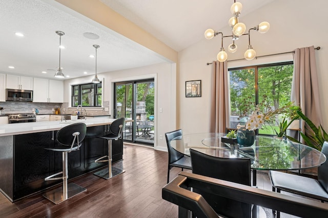538 Silver Lake Rd NW, New Brighton, MN 55112 - dining area featuring dark wood finished floors, recessed lighting, and baseboards