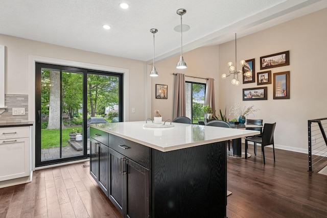 538 Silver Lake Rd NW, New Brighton, MN 55112 - kitchen with dark wood-type flooring, recessed lighting, tasteful backsplash, hanging light fixtures, and white cabinets