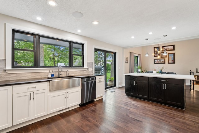 538 Silver Lake Rd NW, New Brighton, MN 55112 - kitchen featuring stainless steel dishwasher, a sink, tasteful backsplash, recessed lighting, and dark wood finished floors