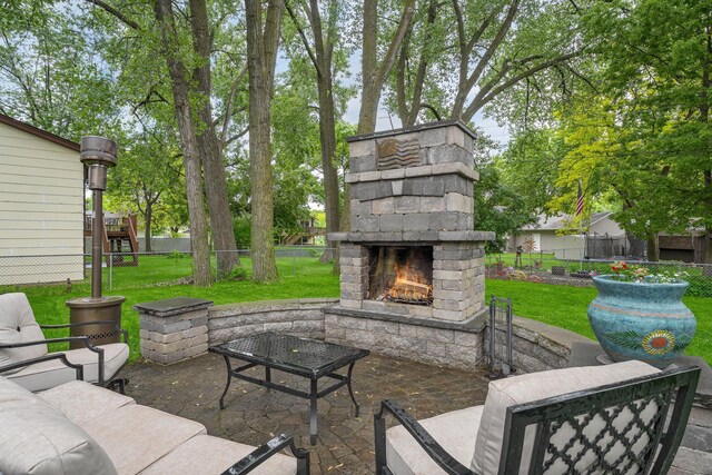 538 Silver Lake Rd NW, New Brighton, MN 55112 - view of patio / terrace with an outdoor stone fireplace