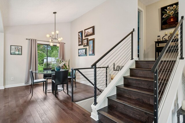 538 Silver Lake Rd NW, New Brighton, MN 55112 - staircase with wood-type flooring, vaulted ceiling, a chandelier, and baseboards