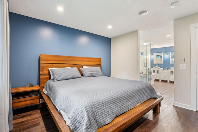 538 Silver Lake Rd NW, New Brighton, MN 55112 - bedroom with hardwood / wood-style floors, recessed lighting, ensuite bathroom, and baseboards