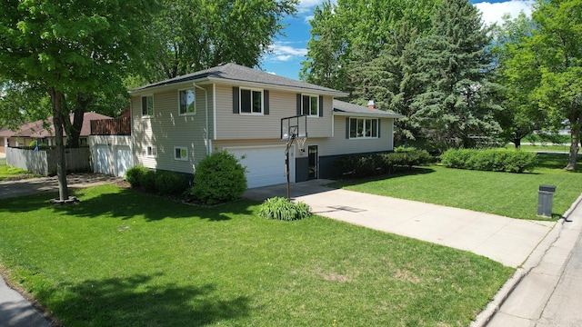 1715 Gateway Dr, Albert Lea, MN 56007 - tri-level home with concrete driveway, an attached garage, and a front yard