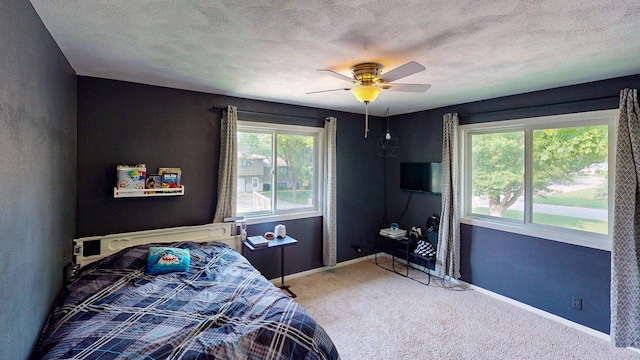 1715 Gateway Dr, Albert Lea, MN 56007 - carpeted bedroom featuring baseboards, ceiling fan, and a textured ceiling