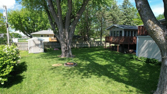 1715 Gateway Dr, Albert Lea, MN 56007 - view of yard featuring a sunroom and a deck