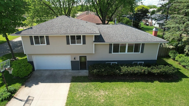 1715 Gateway Dr, Albert Lea, MN 56007 - tri-level home featuring a garage, driveway, and a shingled roof