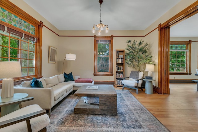 605 7th Ave N, Saint Cloud, MN 56303 - living room with hardwood / wood-style flooring and a chandelier