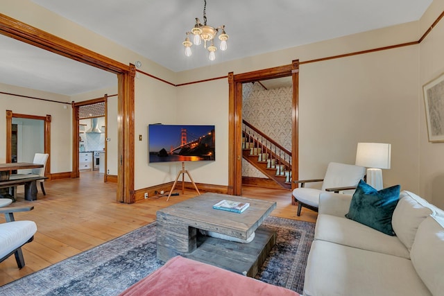 605 7th Ave N, Saint Cloud, MN 56303 - living room featuring a barn door, hardwood / wood-style floors, baseboards, and stairway