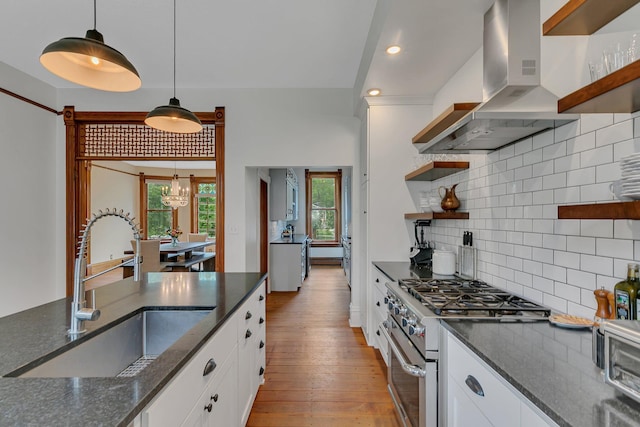 605 7th Ave N, Saint Cloud, MN 56303 - kitchen featuring island exhaust hood, open shelves, high end stove, a sink, and white cabinetry
