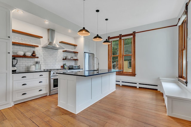 605 7th Ave N, Saint Cloud, MN 56303 - kitchen featuring high end appliances, a baseboard radiator, wall chimney exhaust hood, open shelves, and dark countertops