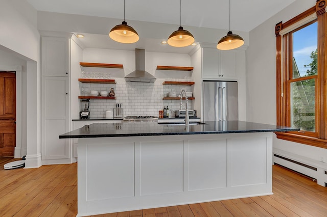 605 7th Ave N, Saint Cloud, MN 56303 - kitchen featuring freestanding refrigerator, open shelves, ventilation hood, a sink, and decorative backsplash