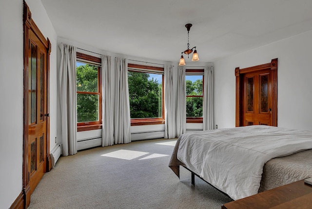 605 7th Ave N, Saint Cloud, MN 56303 - carpeted bedroom with multiple windows and a baseboard heating unit