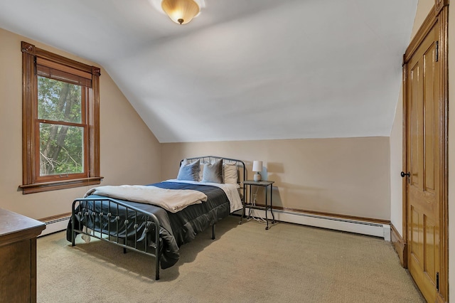 605 7th Ave N, Saint Cloud, MN 56303 - bedroom featuring a baseboard radiator, lofted ceiling, and carpet floors