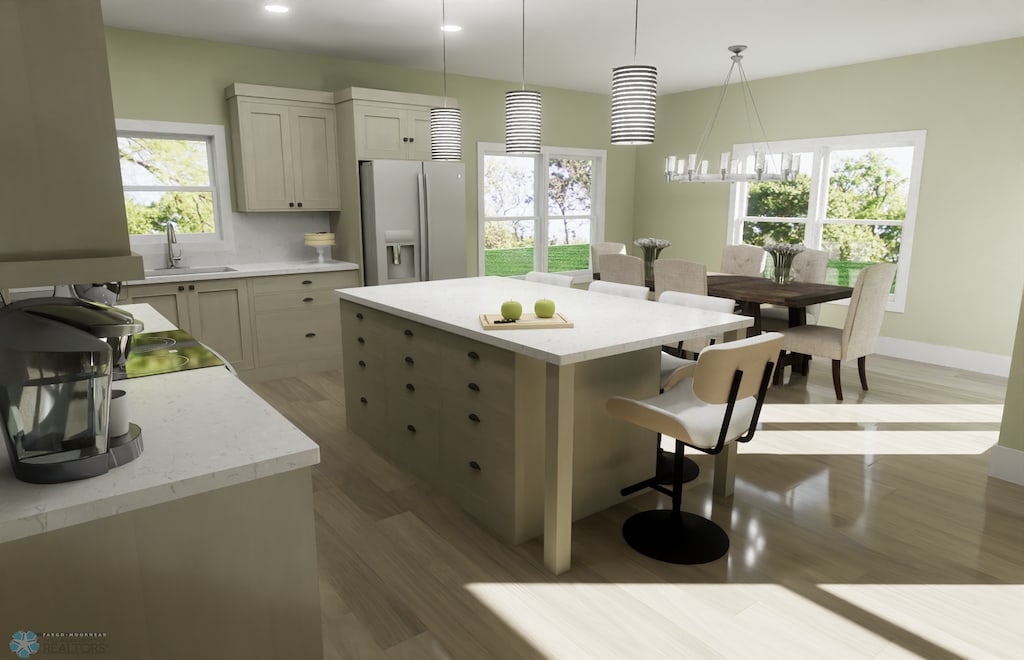 6243 84th Ave S, Horace, ND 58047 - kitchen featuring stainless steel refrigerator with ice dispenser, a breakfast bar, light wood-style flooring, a sink, and pendant lighting