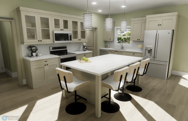 6243 84th Ave S, Horace, ND 58047 - kitchen with white microwave, refrigerator with ice dispenser, a sink, a breakfast bar, and a kitchen island