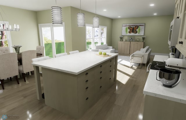 6243 84th Ave S, Horace, ND 58047 - kitchen featuring white microwave, wood finished floors, a kitchen island, hanging light fixtures, and recessed lighting