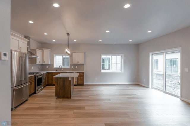 4174 Arthur Dr S, Fargo, ND 58104 - kitchen with appliances with stainless steel finishes, healthy amount of natural light, light wood-type flooring, light countertops, and recessed lighting