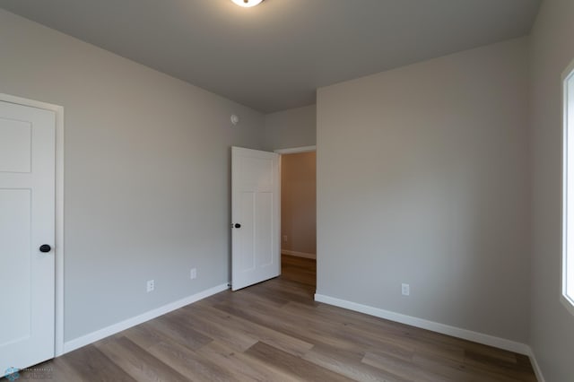 4174 Arthur Dr S, Fargo, ND 58104 - unfurnished bedroom with wood finished floors and baseboards