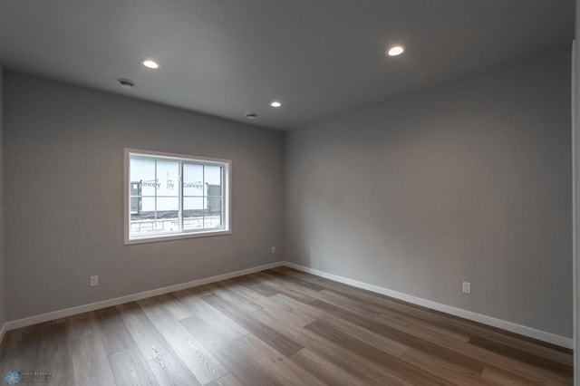 4174 Arthur Dr S, Fargo, ND 58104 - spare room with wood finished floors, recessed lighting, and baseboards