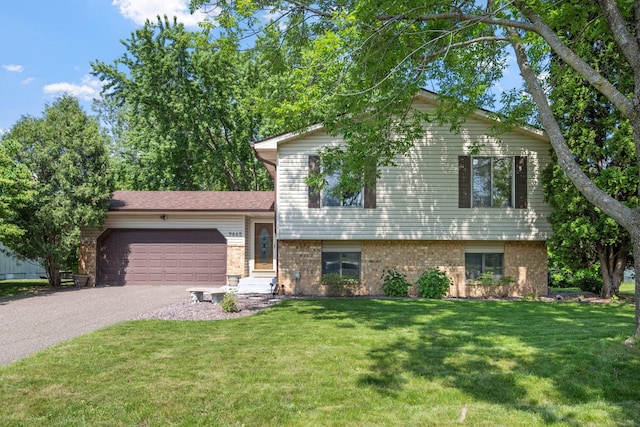 9645 Garrison Way, Eden Prairie, MN 55347 - split level home featuring driveway, a garage, brick siding, and a front yard