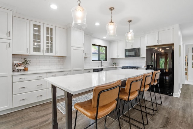 9645 Garrison Way, Eden Prairie, MN 55347 - kitchen featuring black appliances, dark wood-style floors, a sink, white cabinets, and backsplash
