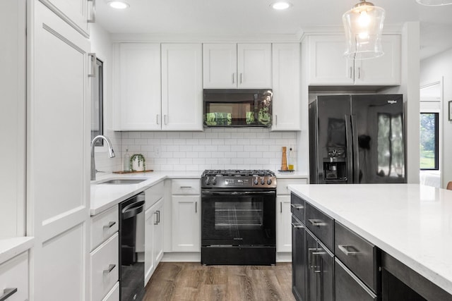9645 Garrison Way, Eden Prairie, MN 55347 - kitchen with black appliances, white cabinetry, a sink, recessed lighting, and tasteful backsplash